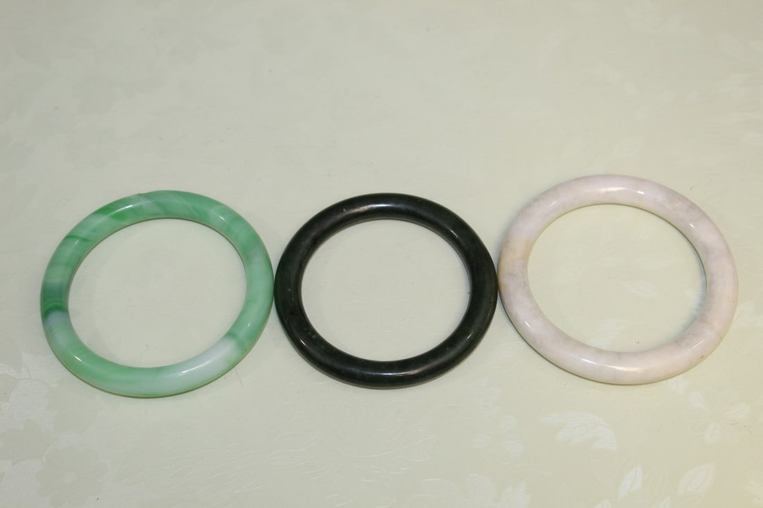 Three Chinese Bangles: Three Chinese Bangles. Inner rim diam 6 cm.