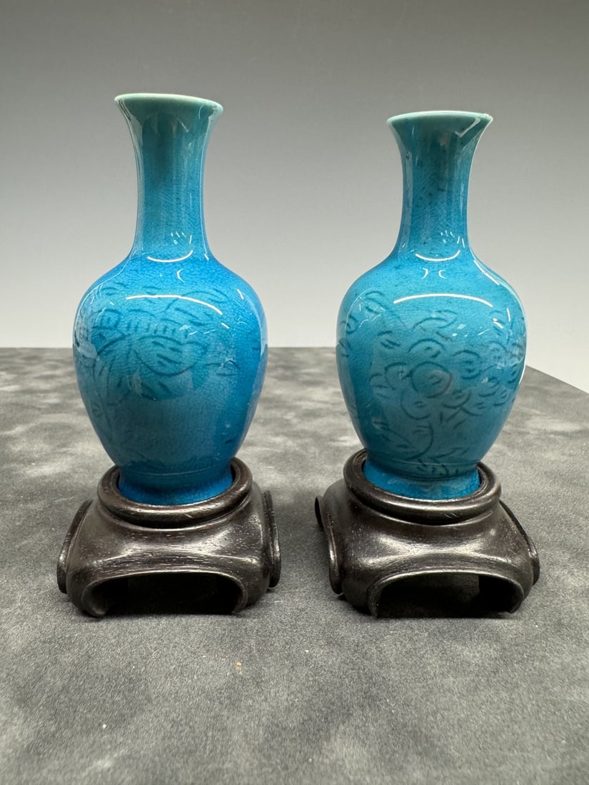 Pair of small peacock-glazed vases with incised flowers on stands: Pair of small peacock-glazed vases with incised flowers on stands. 10cm, vase is mounted to wood stands