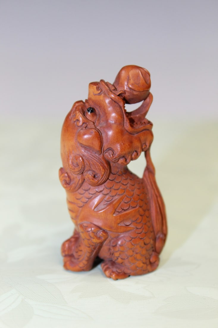 Japanese Carved Wood Netsukes of a Qilin: Japanese Carved Wood Netsukes of a Qilin. H 5 cm.