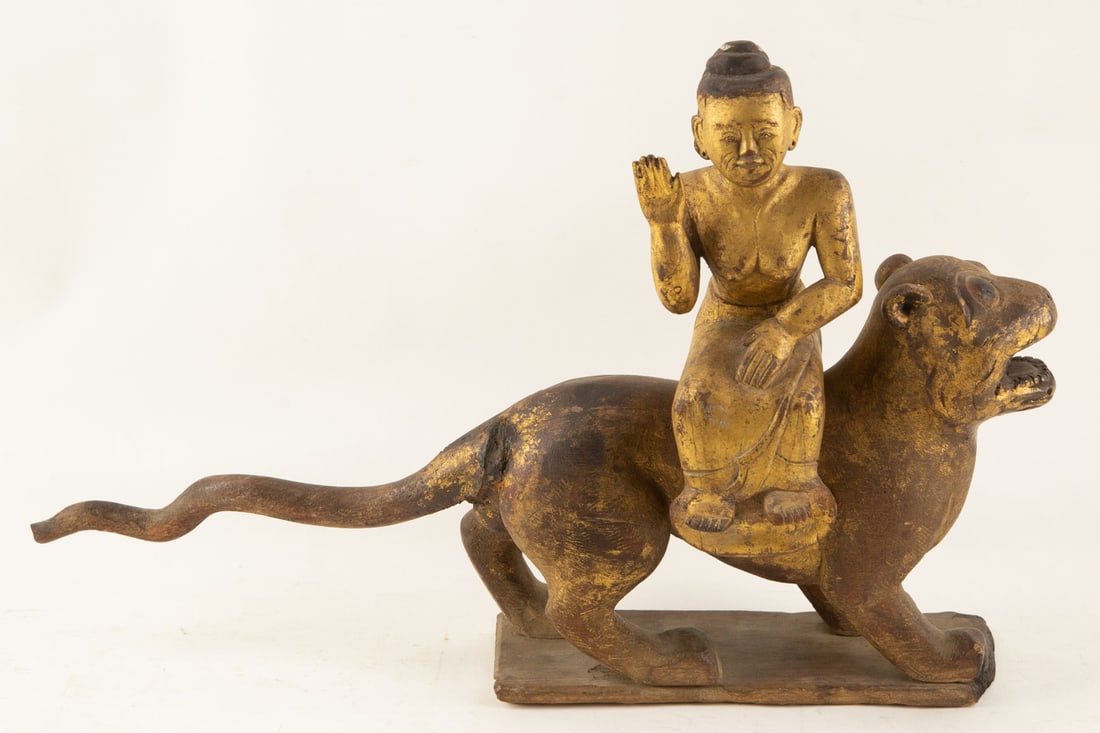 Buddha Riding A Tiger Wood Sculpture: Size: H 14 x L 4.5 x W 22.5 inches Condition: Good overall condition for its age. Shipping:shipping rates are determined by the distance from the auction site.JZD23040064