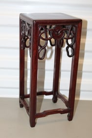 Carved wood stand
