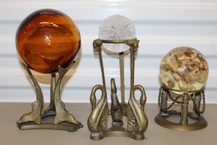 Three balls and four metal stands