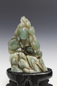 Chinese carved celadon jade peach boulder on stone stand