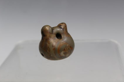 Carved Puddingstone Toggle of a Temple Block