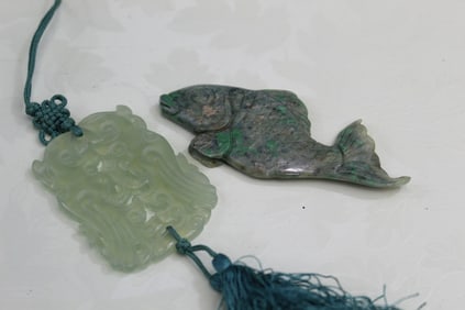 Two Chinese Carved Stone Pendants