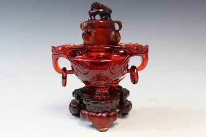 Chinese red plastic incense burner