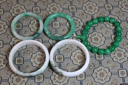 Group of five small Chinese jadeite bangles