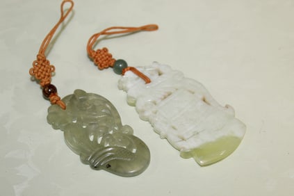 Two Chinese Carved Stone Pendants