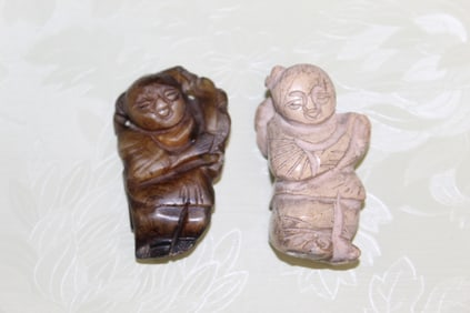 Two Chinese Carved Jade Pendants