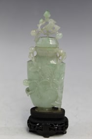 A Very Rare Chinese Caved Jadeite Snuff Bottle