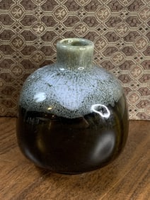 A black glazed porcelain bottle