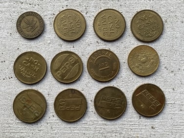 Group of vintage Pepsi tokens and German coin