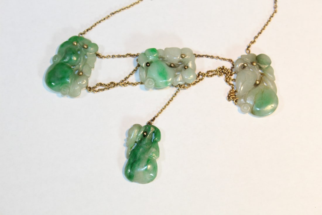 Necklace with Carved Jadeite Pendant: Necklace with Carved Jadeite Pendant. Pendant size 2.5 x 1.5 cm.