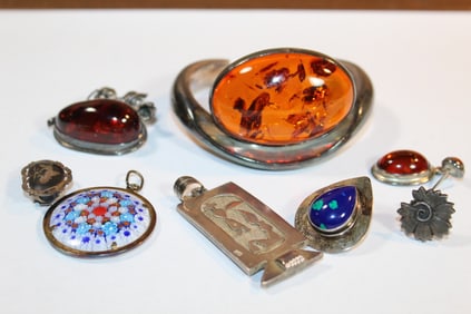Group of sterling and amber jewelry