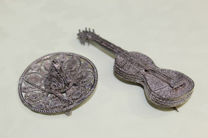 Two Silver Pins