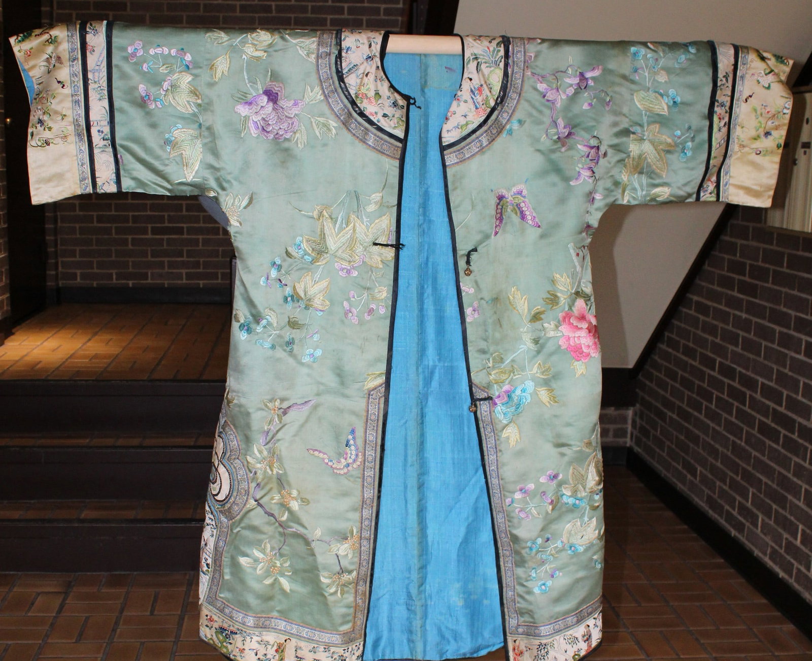 Chinese Embroidery on Green Ground Silk Lady's Robe: Chinese Embroidery on Green Ground Silk Lady's Robe. Sleeve W 135 cm. H 110 cm. As Is.