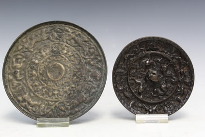 Two Asian bronze mirrors