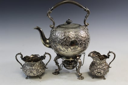 Silver Creamer, Sugar Bowl and a Silver tone Teapot