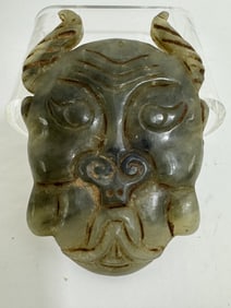 Jade carving of a face