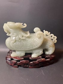 Chinese carved jade Qilin beast on wood stand