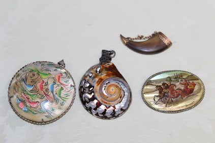 Three Pendants and a Brooch.