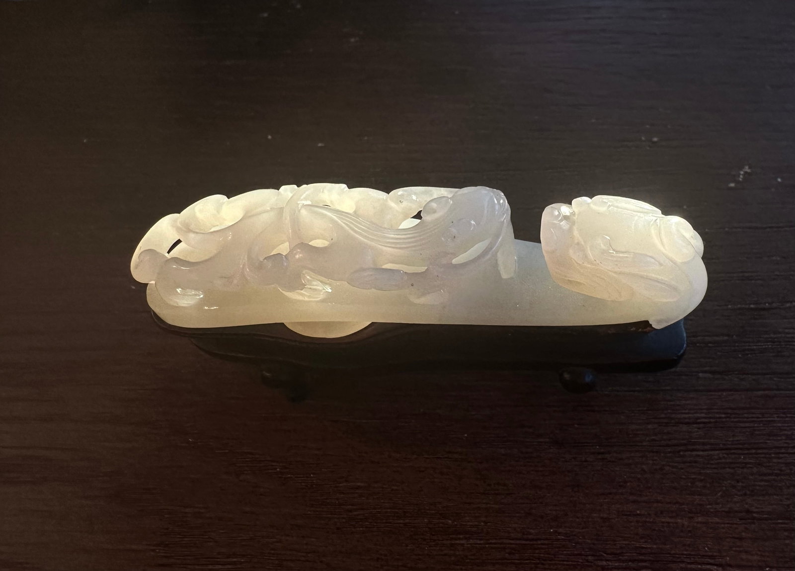 Antique Chinese Carved Jade Belt Buckle: Antique Chinese Carved Jade Belt Buckle. 18/19th C. L 9 cm. With Wood Stand.