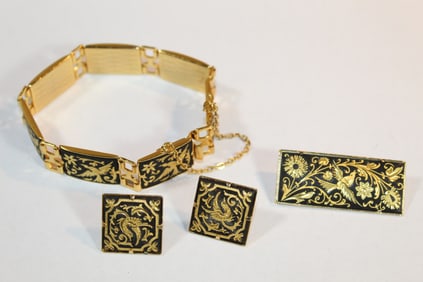 Silver tone metal jewelry set, including bracelet, two ear studs