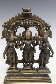 A Bronze Triad of Vishnu Shridevi and Bhudevi.