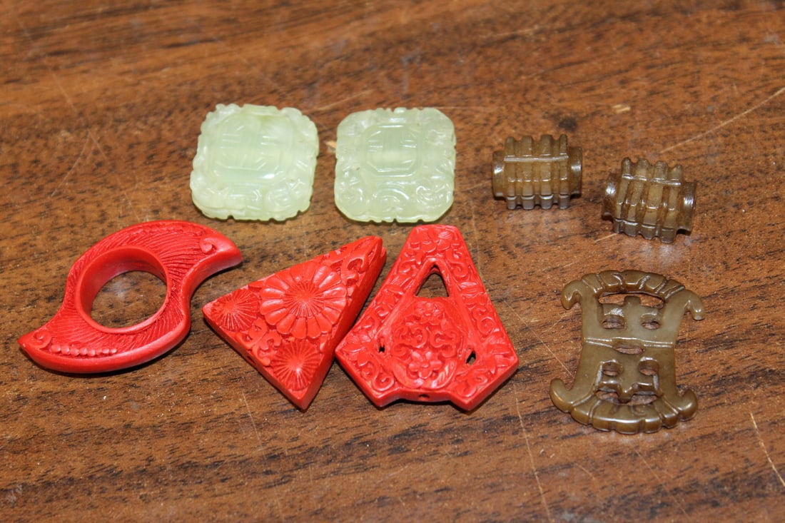 Asian carved beads: Asian carved beads. Largest length 1". Smallest size 1/2 x 1/4 x 1/4".
