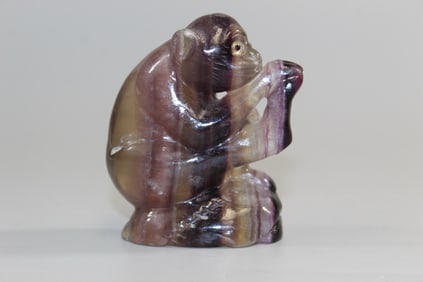 Chinese carved rose quartz statue of a monkey