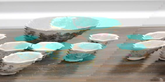 A Chinese famille rose porcelain bowl and seven cups