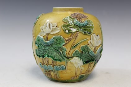 Chinese Sancai Porcelain Jar With Bird and Lotus Flower Relief Decorations.