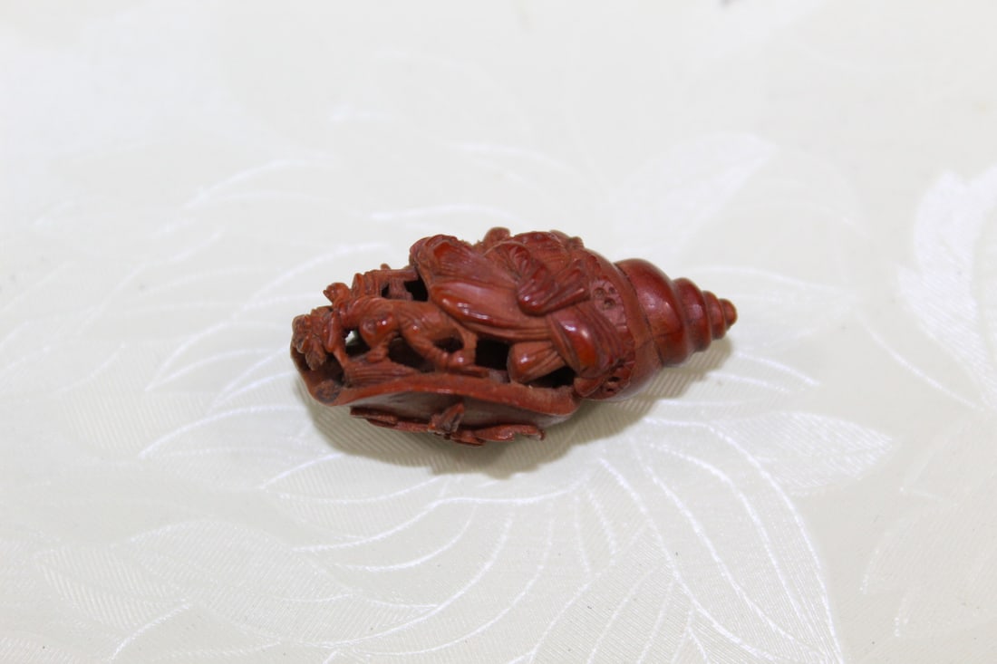 Antique Chinese Carved Olive Nut: Antique Chinese Carved Olive Nut. L 1 1/4".