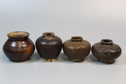 Four Antique Dark Glazed Chinese Pottery Jarlets.