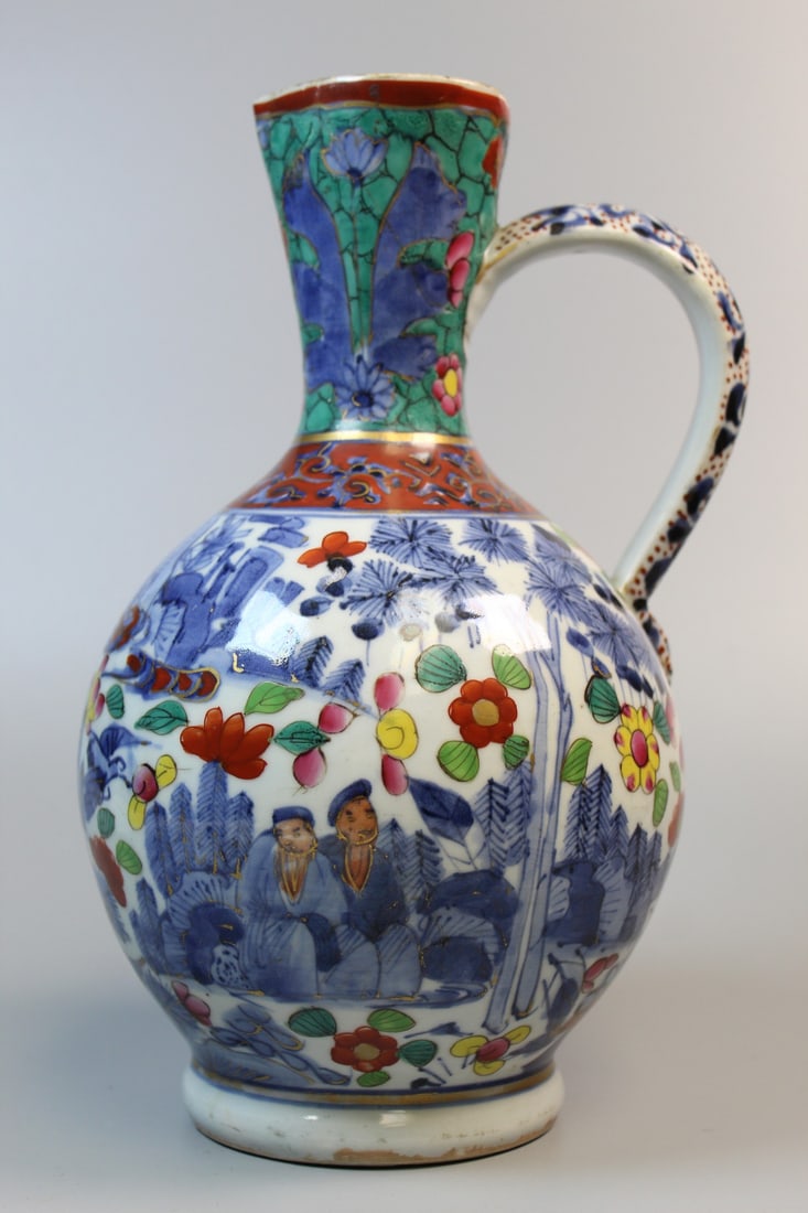 European blue and white porcelain ewer: European blue and white porcelain ewer. H 11". Diam 6".