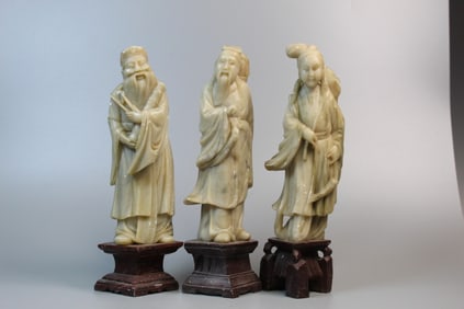 Three soapstone figures.