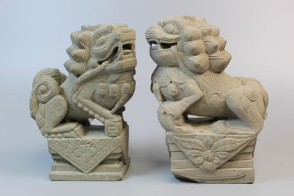 Two carved stone foo lions