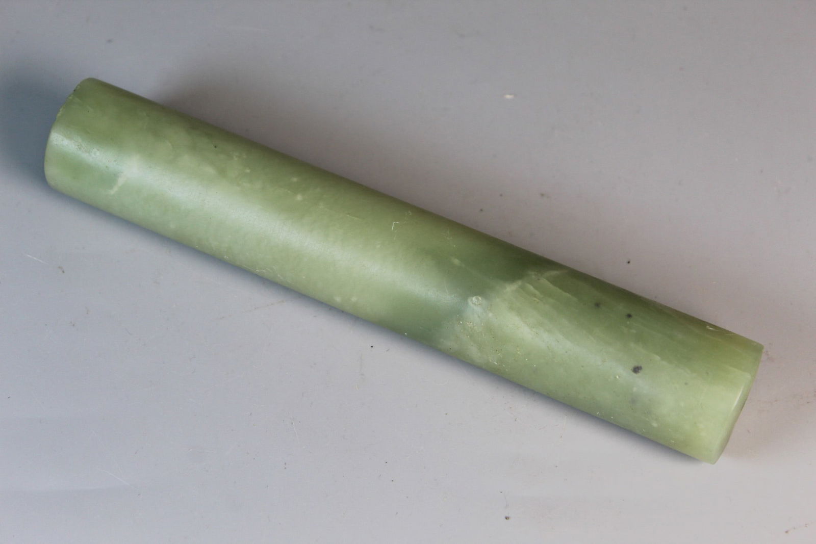 Chinese Celadon Jade Stick: Chinese Celadon Jade Stick. L 7 3/8". Diam 1 1/4".