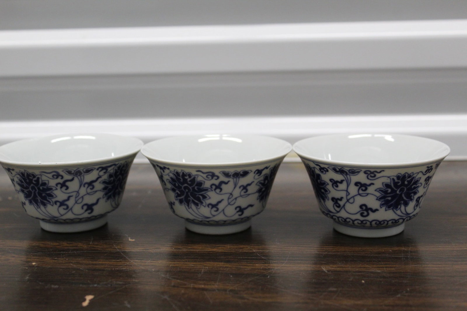 Three Chinese Blue and White Porcelain Cups: Three Chinese Blue and White Porcelain Cups. H 2". Diam 3.5".