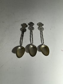 Three Asian sterling silver spoons