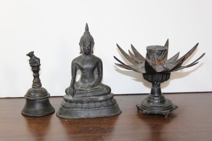 Two vintage bronze Buddha statues and one candle holder