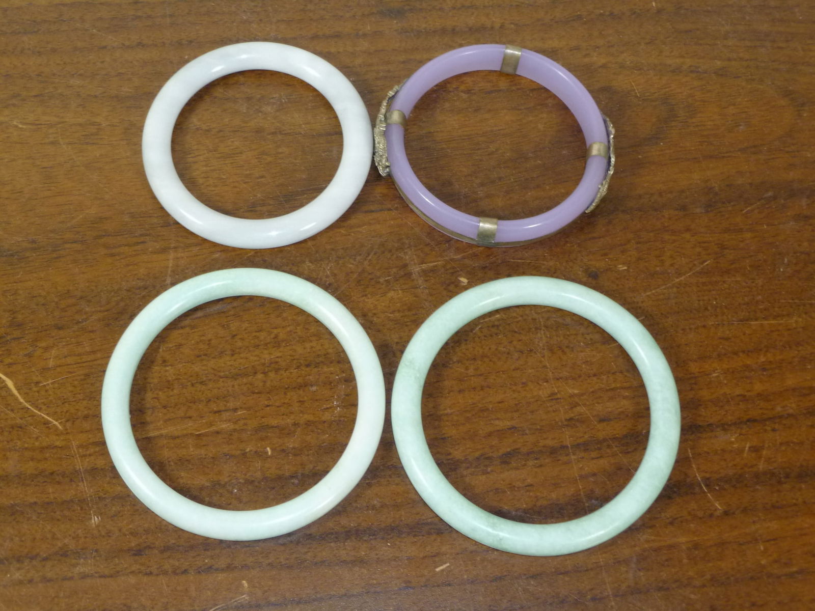 Four Asian bangles: Four Asian bangles. Largest inner diam 2.75"