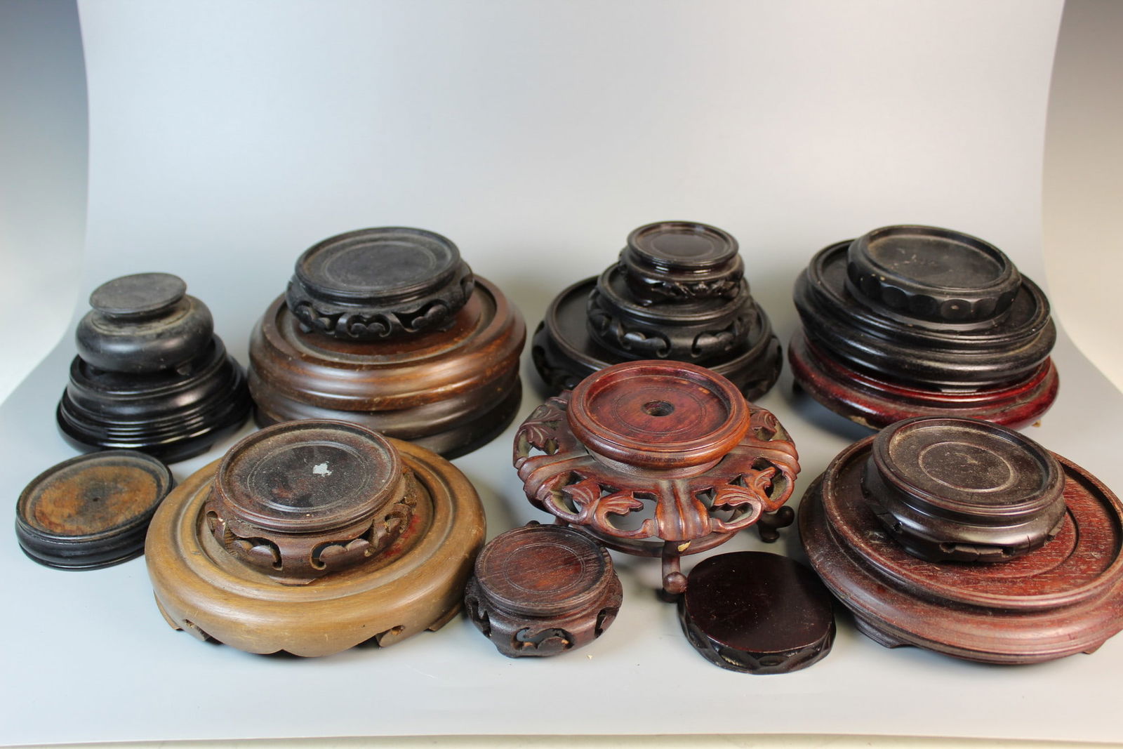 A Group of Asian Wood Stands: A Group of Asian Wood Stands. Largest Diam 5".