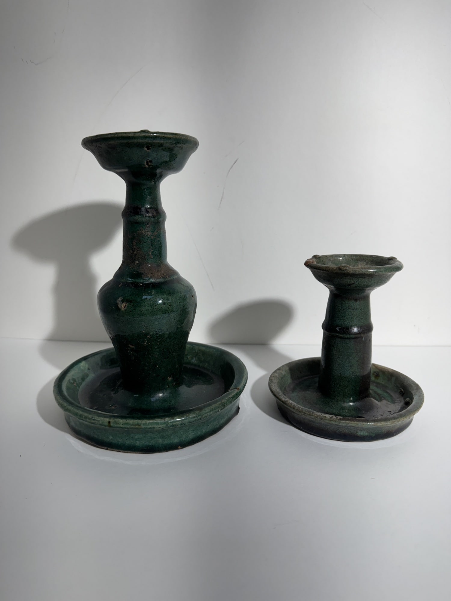Lot of Two Chinese Ceramic Green Glaze Shiwan Oil Lamps: Lot of Two Chinese Ceramic Green Glaze Shiwan Oil Lamps. Height 7.5"