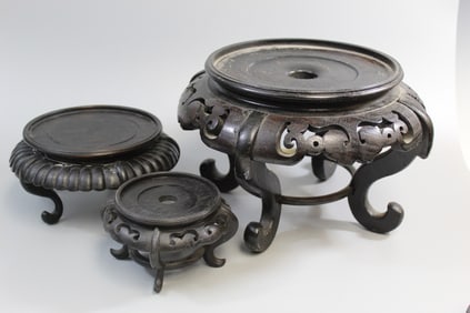 Three carved wood stands