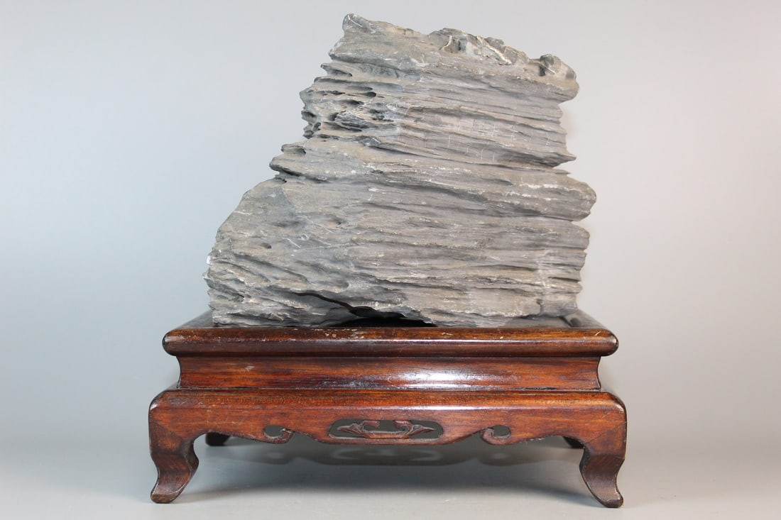 Chinese Scholar's Rock on Wood Stand: Chinese Scholar's Rock on Wood Stand. Rock size 7x8.5x4". Stand 9x6.5x3.5".