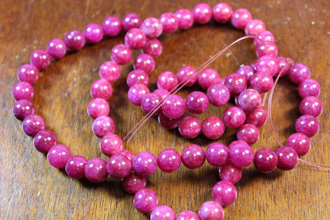 Ruby Color Stone Beads: Ruby Color Stone Beads. Diam 0.75".