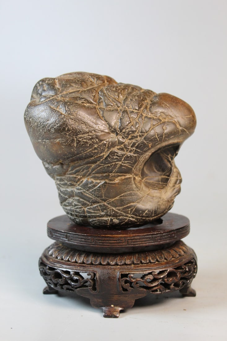 Chinese Scholar's Rock on Wood Stand: Chinese Scholar's Rock on Wood Stand. Rock 3.5x4x2".