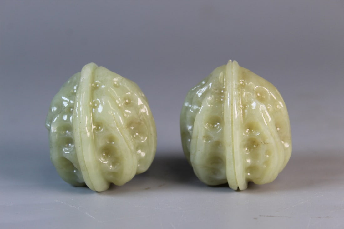 A Pair of Chinese Carved Walnuts: A Pair of Chinese Carved Walnuts. H 1.75".