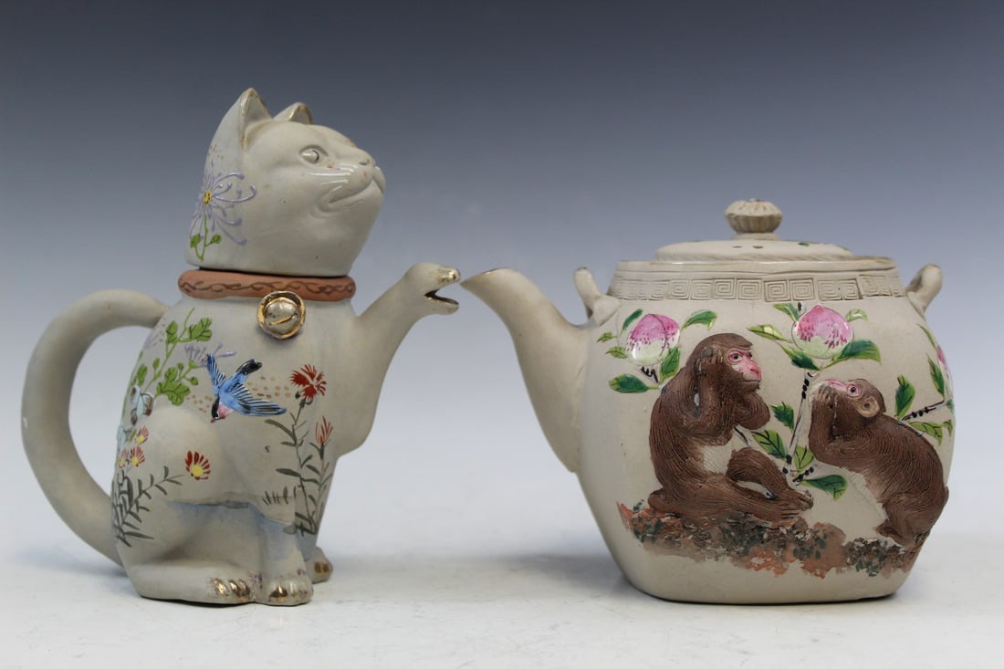 Two Japanese Porcelain Teapots: Two Japanese Porcelain Teapots. Cat H 6". Monkey teapot H 4".